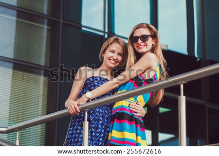 red haired girls friends laughing and hug