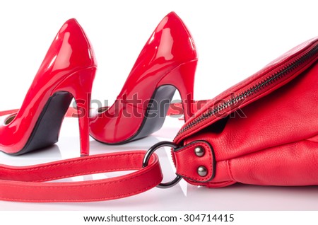 Red handbag and high heel shoes, isolated on white