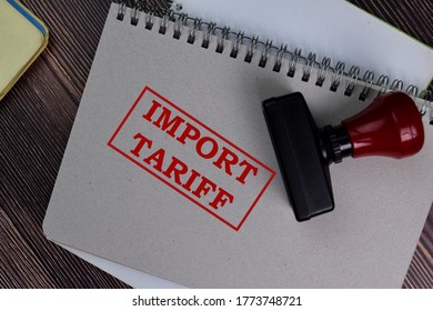 Red Handle Rubber Stamper and Import Tariff text isolated on the table. - Shutterstock ID 1773748721