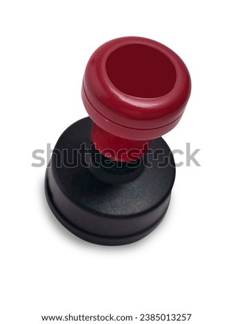 Red handled round rubber stamp, top view isolated on white with copy space