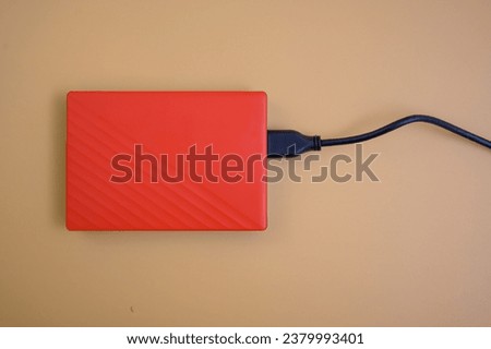 Red hard disk yellow background
