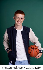 Red Head Boy Holding Basketball Ball And Looking At Camera
