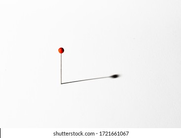 Red Head Pin On A White Background