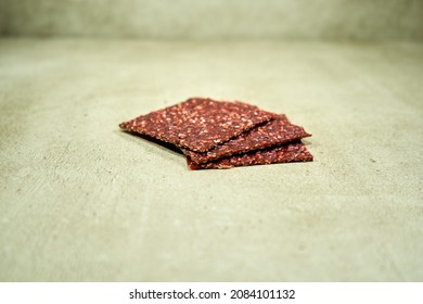 Red Healthy Flaxseed Crackers On The Surface. 