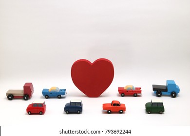 Red Heart And Cars On White Background.
Safe Driving Concept.