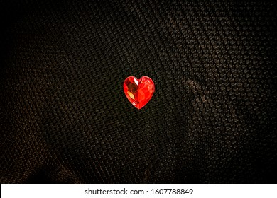 Red Heart Gem Stone On Black Background