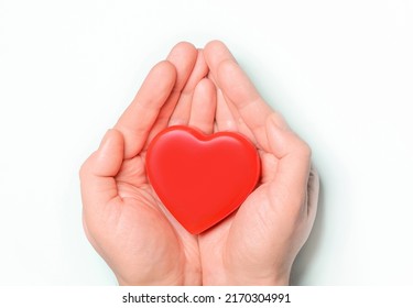 Red heart in hands on white background. Healthcare and hospital medical concept,organ donation concept.Symbolic of Valentine day.Heart day.?opy space.