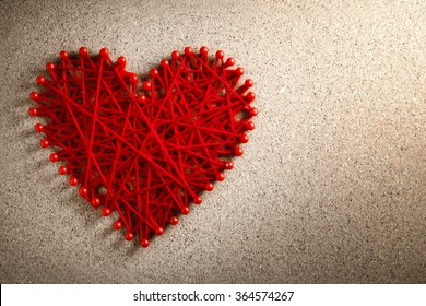 Red Heart Made From Wool Pinned Into Corkboard,Valentines Day Concept.