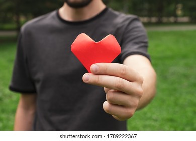Red heart in man hand. Health, World heart day, love and charity concept. Close up - Shutterstock ID 1789222367