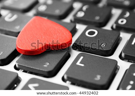 Red heart on the computer keyboard