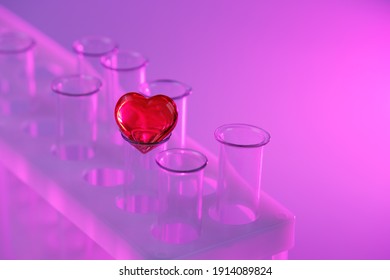 Red Heart On A Glass Test Tube. Concept: Love Potion, Synthetic Love Drugs, Chemistry. Baby From Tube Vitro Glass. Artificial Conception 