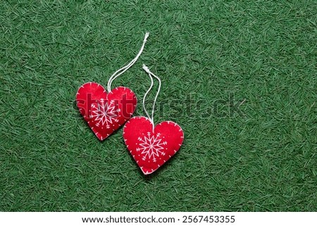 red heart on a pine needless scattering, dark green textured background, new year, Christmas and winter background