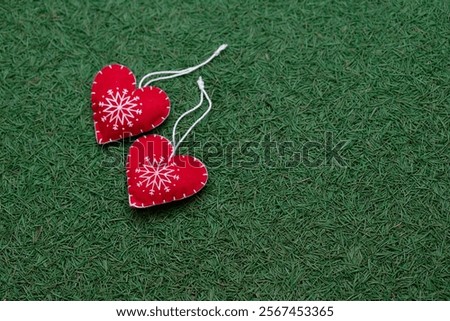red heart on a pine needless scattering, dark green textured background, new year, Christmas and winter background