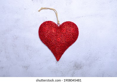 Red heart on stone cement background. Top view with copy space