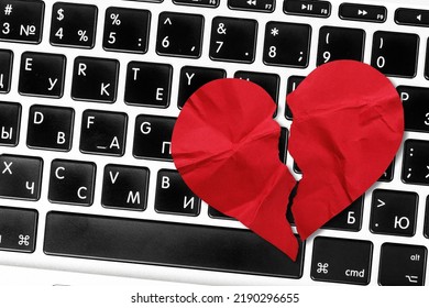 Red Heart Paper On Keyboard Computer Background. Online Internet Romance Scam Or Swindler In Website Application Dating Concept. Love Is Bait Or Victim.