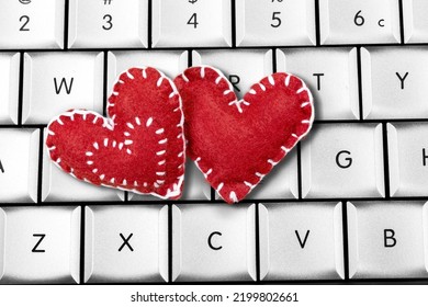 Red Heart Paper On Keyboard Computer Background. Online Internet Romance Scam Or Swindler In Website Application Dating Concept. Love Is Bait Or Victim.