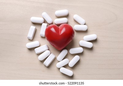 Red Heart With Pills On Table