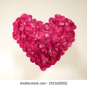 Red Heart Of Rose Petals On A White Background