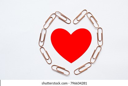 Red Heart In Heart Shape Paperclip On White Background, Love And Romance