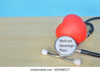 Red heart shape and stethoscope with text MEDICARE ADVANTAGE PLANS - Shutterstock ID 2019380177