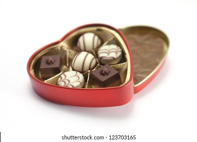 Red Heart Shaped Box Of Chocolates On A White Background