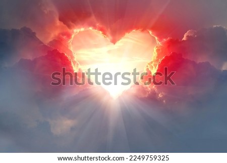  Red heart shaped clouds at sunset. Beautiful love background with copy space.Valentine's Day concept.