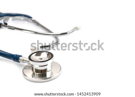Red heart and a stethoscope on a white background.