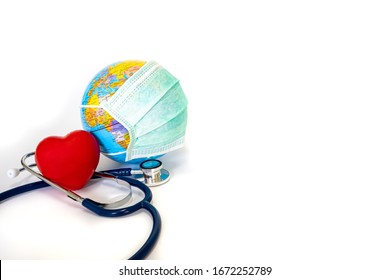 Red Heart And A Stethoscope With The World Is Wearing A Mask To Protect The Corona Virus Attack. The Planet Earth With A Mask By The Coronavirus. World Health Day, Healthcare And Medical Concept.