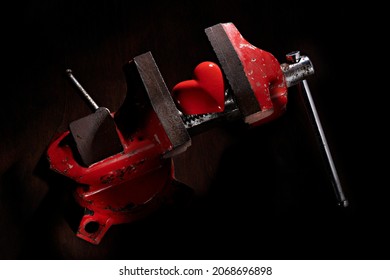 Red Heart Tightened By An Iron Vice.