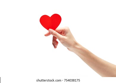 Red heart in woman hand isolated on white . Valentine's day 