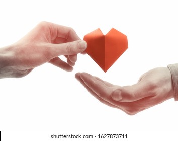 Red Heart In Woman And Man Hands. Black And White Image On Isolated White Background. Concept Of Love,  Giving Gifts, Donorship.