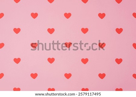 Red hearts pattern, paper cut romantic concept, top view. Beautiful cute hearts on pastel pink background.. Valentines Day greeting card concept. Flat lay art.