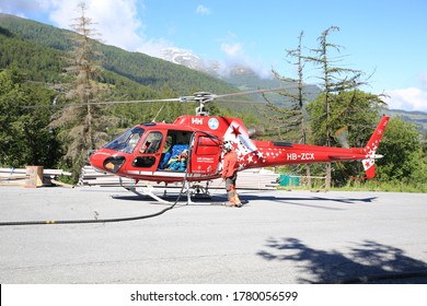 Red Helicopter Of Air Zermatt In Bürchen, Switzerland, 06-22-2020