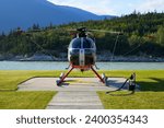 Red helicopter parked at Skagway Airport in Alaska