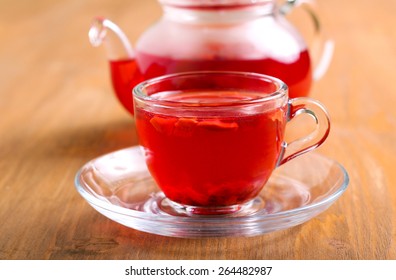 Red Herbal And Fruit Tea In Cup And Tea Pot