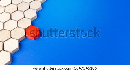 Red hexagon connects to majority structure of others. Start a chain reaction. Dissimilarity and dissent. Uniqueness initiative. Break order. Superfluous, unsuitable. Going beyond. Untypical Concept .