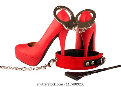 Red High Heels, Riding Crop And Dog Collar Isolated On White Background. Bondage Concept.