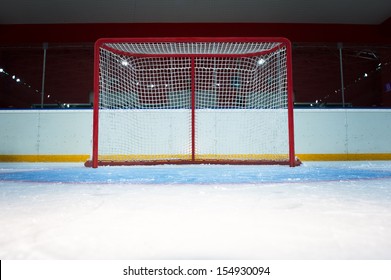Red hockey goal. Front view from ice