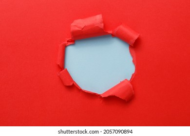 red Hole in the paper with torn sides. christmas background