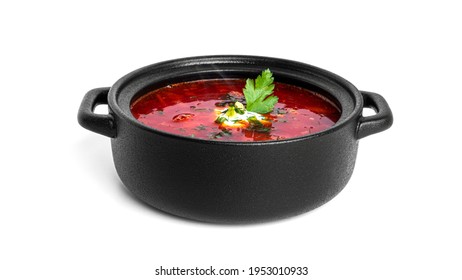 Red, Hot Borscht - Beet Soup With Sour Cream And Herbs In Black Pot Isolated On A White Background. High Quality Photo