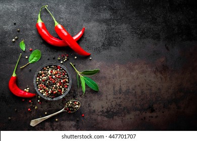 red hot chili pepper corns and pods on dark vintage metal culinary background, top view - Powered by Shutterstock