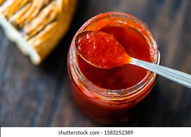 Red Hot Chili Pepper Sauce for Artisan Cheese made with Vinegar and Sugar in Glass Bowl with Spoon. - Powered by Shutterstock