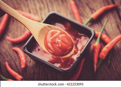 Red Hot Chilli Sauce In Wood Spoon