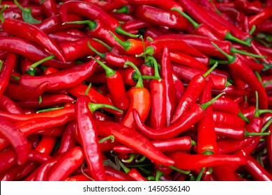 Red hot fresh raw chili peppers in outdoor market - Powered by Shutterstock