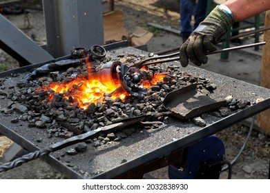 Red Hot Metal In A Forging Furnace Preparing For Forging Process At Workshop.