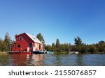 A red house boat on Great Slave Lake in Yellowknife, Northwest Territories, Canada.