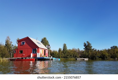 A Red House Boat On Great Slave Lake In Yellowknife, Northwest Territories, Canada.