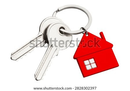 Red house keyring with two silver keys, isolated on white background