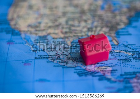 Red house on Mexico part of world map. Real estate / citizenship/ immigration in Mexico concept.