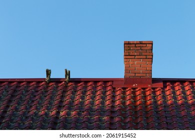 Red House Roof With Red Brick Chimney